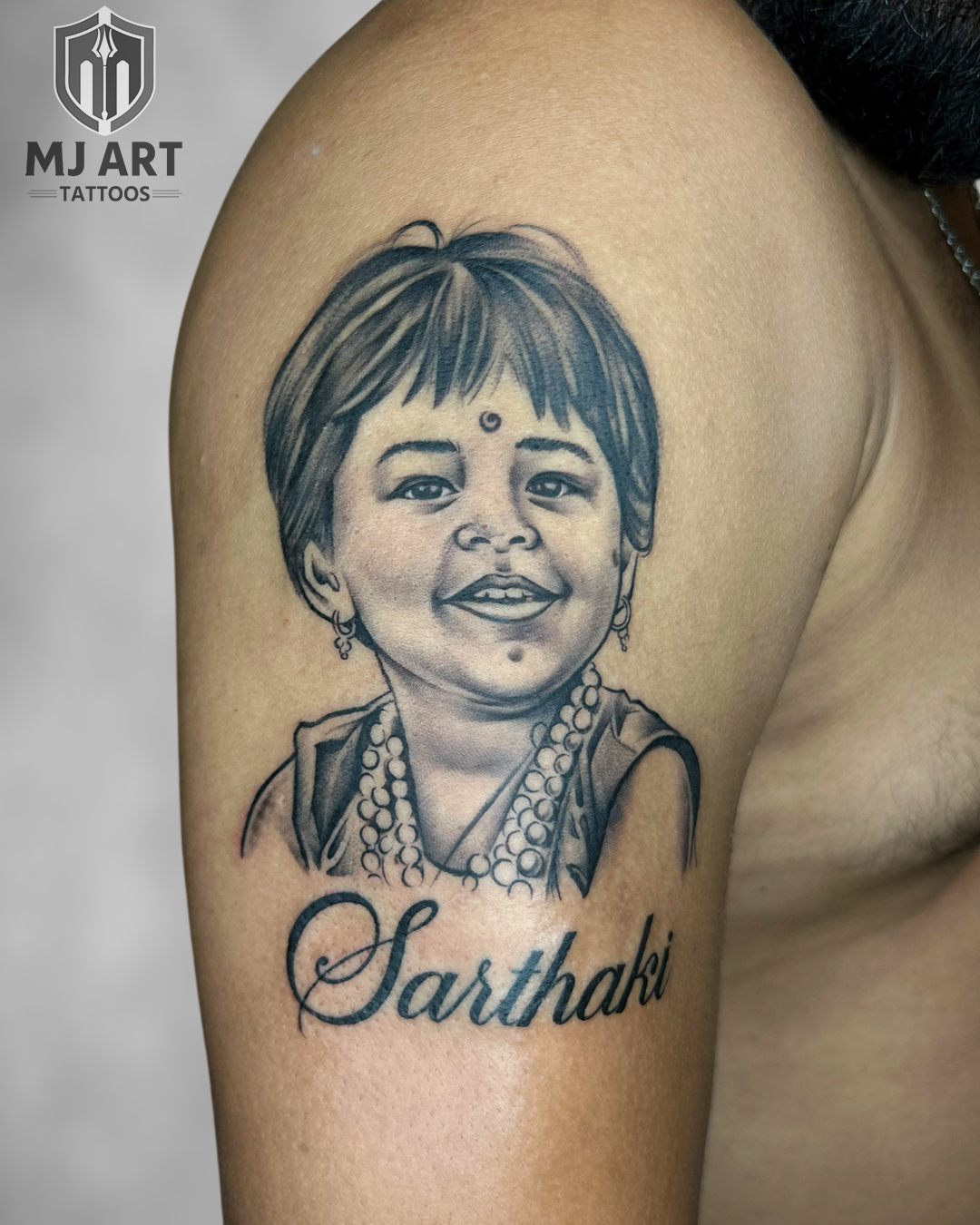 Sarthaki Portrait Shoulder Tattoo